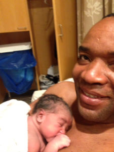 Dad holds baby skin-to-skin following C-section until mom is ready